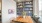 study room with a wooden table and a shelf of books